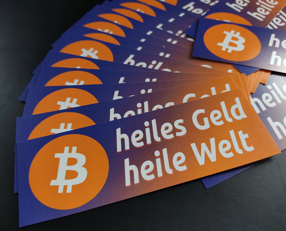 Bitcoins Aufkleber "heiles Geld heile Welt" eckig orange blau Farbverlauf vegan
